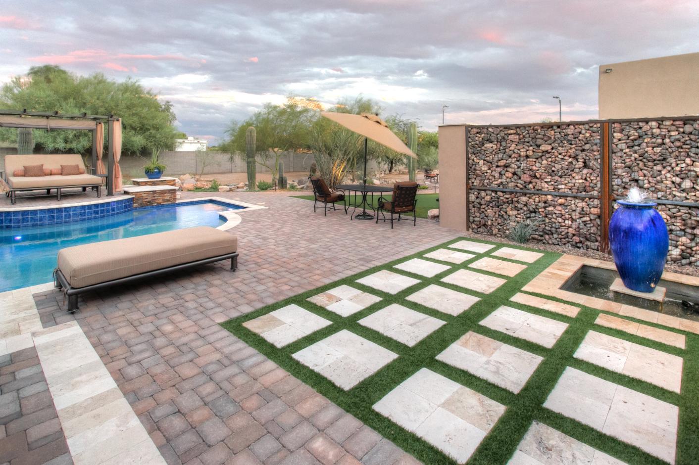 Happy customers with their landscaped backyard